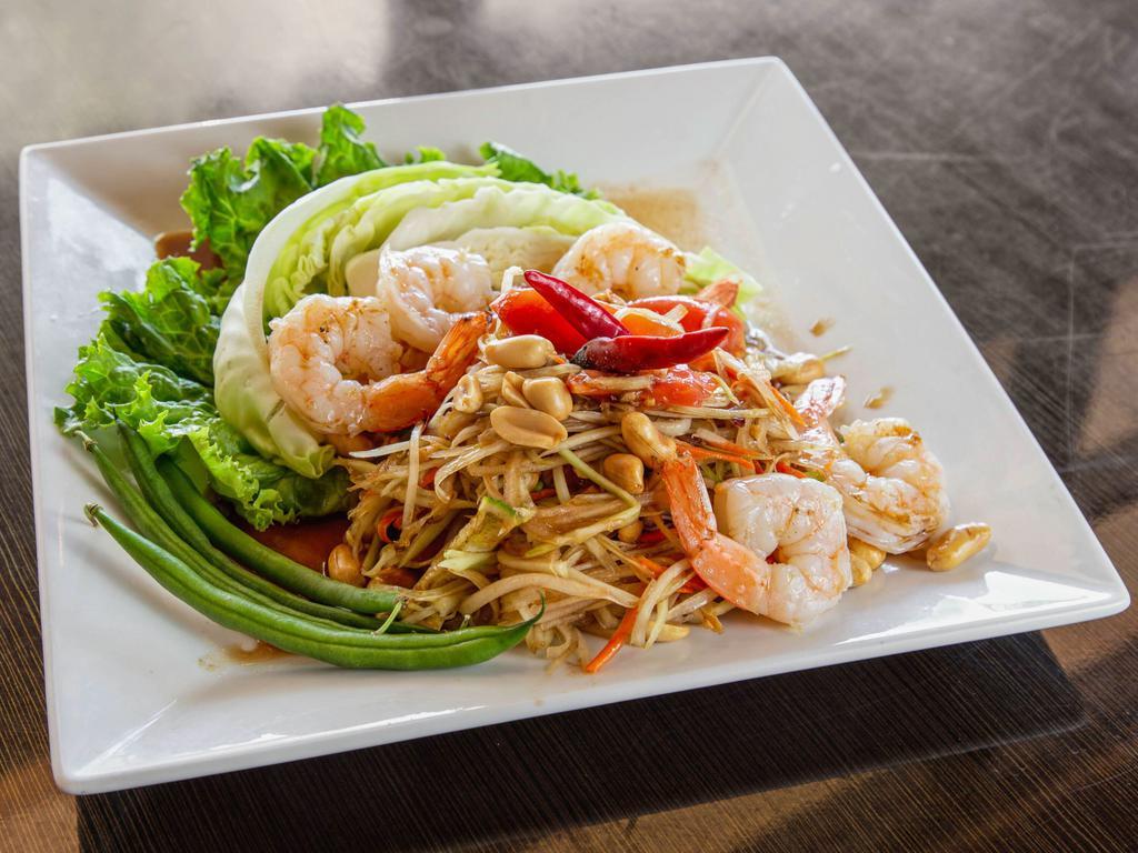 24. Papaya Salad with Shrimp · Thai style salad, fresh green papaya, carrots, tomatoes, green beans, peanuts in spicy lime dressing. Spicy. 