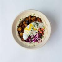 Eggplant Sabich Bowl · Crispy, golden eggplant cubes, and boiled egg served over a base of your choice: creamy humm...