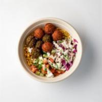 Falafel Bowl · Choose between Taïm’s traditional green falafel or harissa falafel (or a mix of both) served...