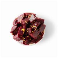 Marinated Beets  · Cooked beets infused with roasted garlic, coriander, lemon zest and extra virgin olive oil.