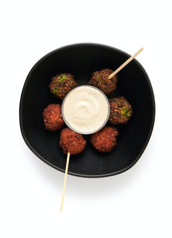 Falafel + Tahini · Choose traditional green or our spicy harissa falafel - or do a mix of both!  Includes 8 falafel balls and served with a side of creamy tahini sauce.