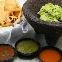 Warm Tortilla Chips & Salsa Trio · Tortilla chips with house made salsa verde, roasted tomato, and habanero salsas. Vegetarian,...