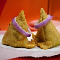 Meat Samosa · 2 pieces. Crispy pastry turnover filled with meat.