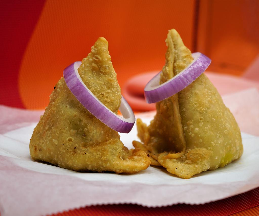 Meat Samosa · 2 pieces. Crispy pastry turnover filled with meat.