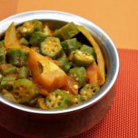 Bindi Bazi · Pices of fresh okra sauteed with, tomatoes and exotic spices.