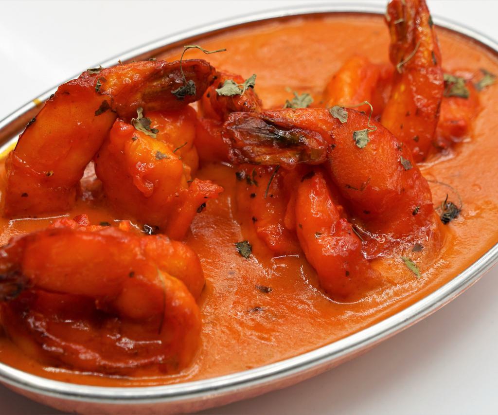 Shrimp Tandoori Masala · King size jumbo shrimp marinated, grilled in clay oven, then cooked with a creamy thick masala sauce.