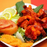 Shrimp Tandoori · King-sized jumbo shrimp marinated, grilled in clay oven and served with mushroom or spinach.