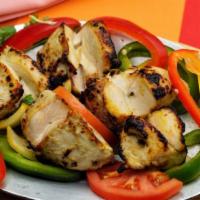 Malai Kebab · Tender pieces of chicken breast marinated in special cream sauce and grilled in tandoori oven.