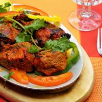 Lamb Tikka · Cubed leg of lamb marinated in milk spices, grilled in clay oven.