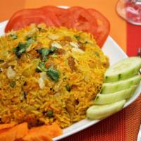 Chicken Biriyani · Chicken, sauteed in herbs and spices, cooked with special Pakistani basmati rice with almond...