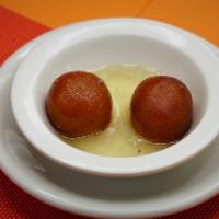 Gulab Jamon · Fried cheese ball dipped in honey syrup.