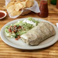 Burrito Grande · An over-sized flour tortilla filled with rice, whole beans, chopped onions, cilantro and you...