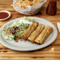 Special Chimichanga · 1 chicken, 1 shredded beef and shrimp chimichanga topped with lettuce, pico de gallo, sour c...