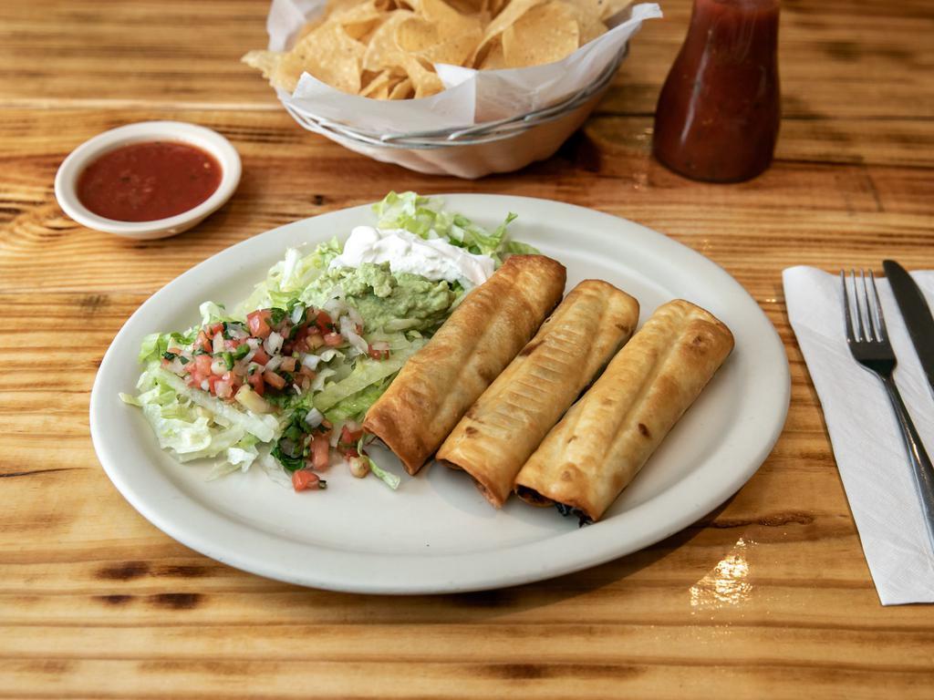 Special Chimichanga · 1 chicken, 1 shredded beef and shrimp chimichanga topped with lettuce, pico de gallo, sour cream and guacamole. Served wth rice and beans.