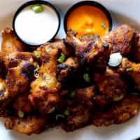 Jumbo Chicken Wings · breaded bone-in chicken wings + choice of ranch or bleu cheese dipping sauce + celery sticks