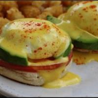 The California · Avocado and grilled tomato slices, topped with 2 poached eggs and hollandaise sauce.
