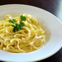 Fettuccine Alfredo · Flat thick pasta.