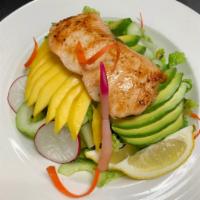 Grilled Salmon Salad · Grilled salmon and avocado cucumber mango on the top of mixed greens with soy mustard sauce.