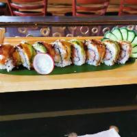 Dragon Roll · Shrimp tempura and  crab stick topped with eel, avocado, and eel sauce.