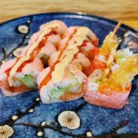 Pink Lady Roll · Spicy salmon, shrimp tempura, cucumber, avocado, and tobiko wrapped with soybean paper. Topp...