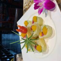 Four Season Roll · Tuna, real crab meat, avocado, mango, and wrapped with soybean paper. Topped with mango sauce.