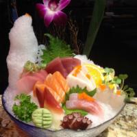 Sashimi Deluxe · 18 pieces of chef’s choice assorted sashimi and a bowl of rice.