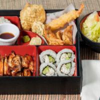 31. Chicken Bento · A fancy meal that includes rice, salad, chicken teriyaki, California roll, and various tempu...
