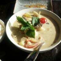 40. Yellow Curry · Your choice of meat potato, tomatoes onions, and Thai basil cooked In yellow coconut curry.