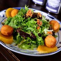 Roasted Golden Beet Salad Dinner · Herbed goat cheese fritters, sliced golden beets, candied walnuts, dried cranberries, organi...