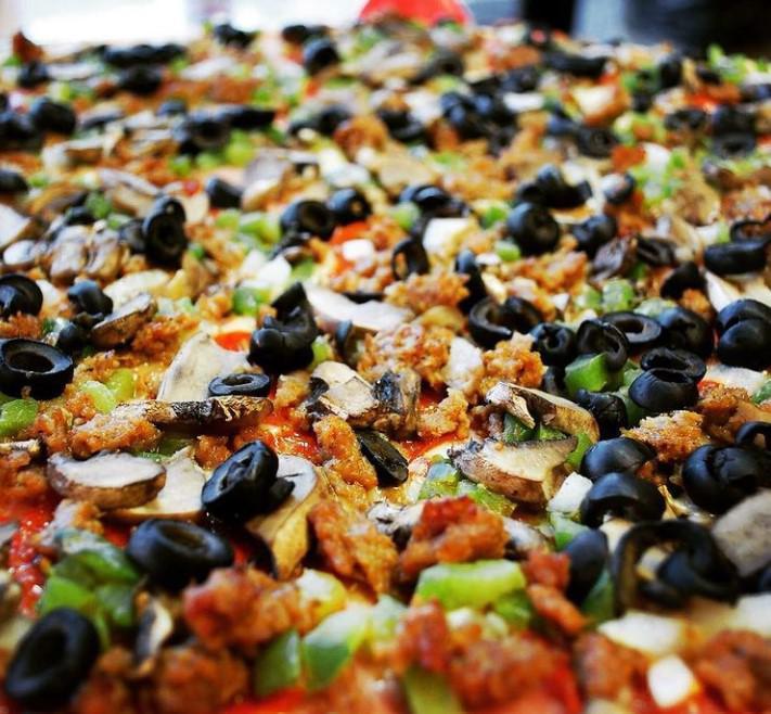 Supreme Pie · Want a pizza that has it all? Your supreme pizza from Spicy Pie comes loaded with the best ingredients of pepperoni, Canadian bacon, sausage, green peppers, mushrooms, onions, and black olives. You can also have it all, and have it delivered to your home.