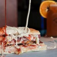 Ultimate Grinder · Turkey, ham, salami, taco meat, Colby cheese, Swiss-American cheese, lettuce, and red and wh...