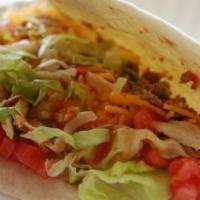 Soft Shell Taco · Taco meat or shredded chicken, lettuce, Colby cheese, tomatoes, and red grinder sauce loaded...
