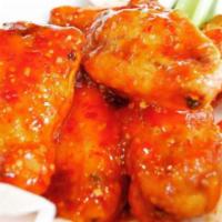 Bone-in Wings · Our bone-in wings smothered in your choice of sauce. BBQ, Buffalo, sweet Thai chili or try o...