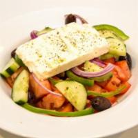 Greek Salad · Vine ripe tomatoes, cucumbers, red onions, feta cheese and Greek olives, served with extra v...