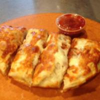 Cheese Calzone · A baked or fried turnover of pizza dough stuffed with savory fillings.