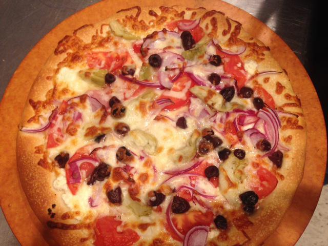 Greek Pizza · No sauce. Feta cheese, Kalamata olives, tomatoes, red onions and artichoke.