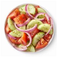 Cucumber tomato Salad  · House marinated cucumbers, tomatoes and onions.