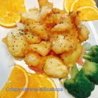 S10. Crispy Shrimp & Scallops · Jumbo shrimp and  fresh scallops deep fried with spicy garlic sauce on the top, circle with ...