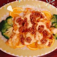 S15. Jumbo Shrimp with Honey Walnuts · Jumbo shrimp deep fried crispy with house special sauce topped with mango sauce.	