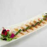 New Style Sashimi · Thinly sliced fluke served with hot olive oil poured over yuzu sauce.