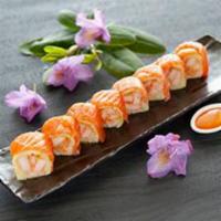 Prince Roll · Rock shrimp tempura inside, top with salmon, soy paper and spicy sauce.