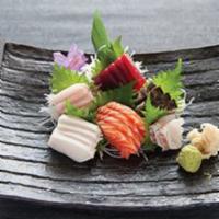 Sashimi Deluxe · 21 pieces. Served with miso soup or salad.