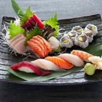 Sushi and Sashimi Combo · 5 pieces sushi, 16 pieces. Sashimi and 1 tuna roll. Served with miso soup or salad.