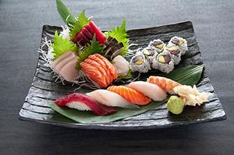 Sushi and Sashimi Combo · 5 pieces sushi, 16 pieces. Sashimi and 1 tuna roll. Served with miso soup or salad.