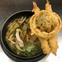 Tempura Udon · Shrimp, vegetable tempura and noodle in clear broth. Served with miso soup or salad.
