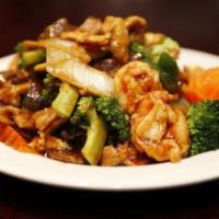 S7. Triple Delight · Chicken, beef and shrimp with mixed vegetables in brown sauce.