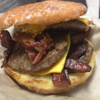 Donut Burger · Bigworm's customized glazed donut, 2 patties with cheese, 2 slices of bacon, 1 egg and

 top...
