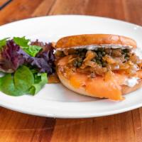 Lox, Cream and Bagel · Fresh smoked salmon topped with savory capers, onion and traditional cream cheese.