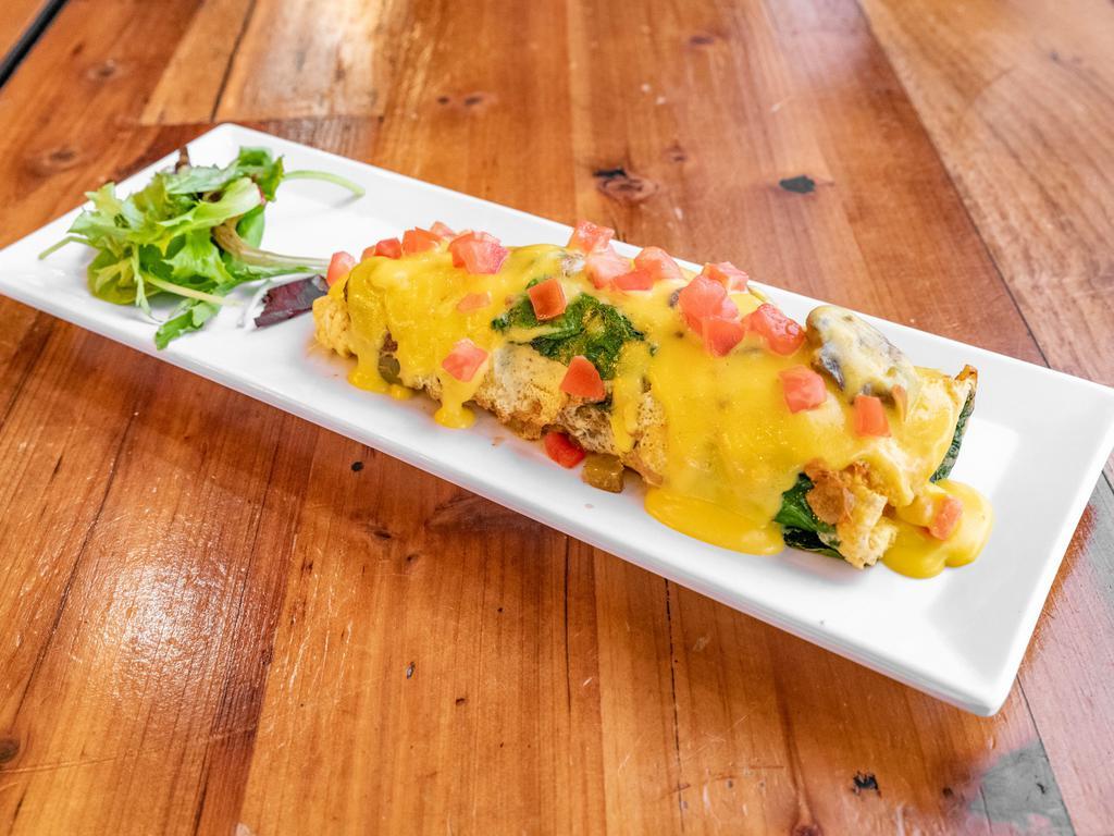 Healthy Choice Omelette · 3 egg omelette cooked with mozzarella cheese topped with mushrooms, green peppers, onions, tomatoes and premium spinach with hollandaise sauce.