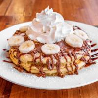 Nutty Professor Pancake · Original fluffy buttermilk pancakes smothered with Nutella, chocolate syrup and topped with ...